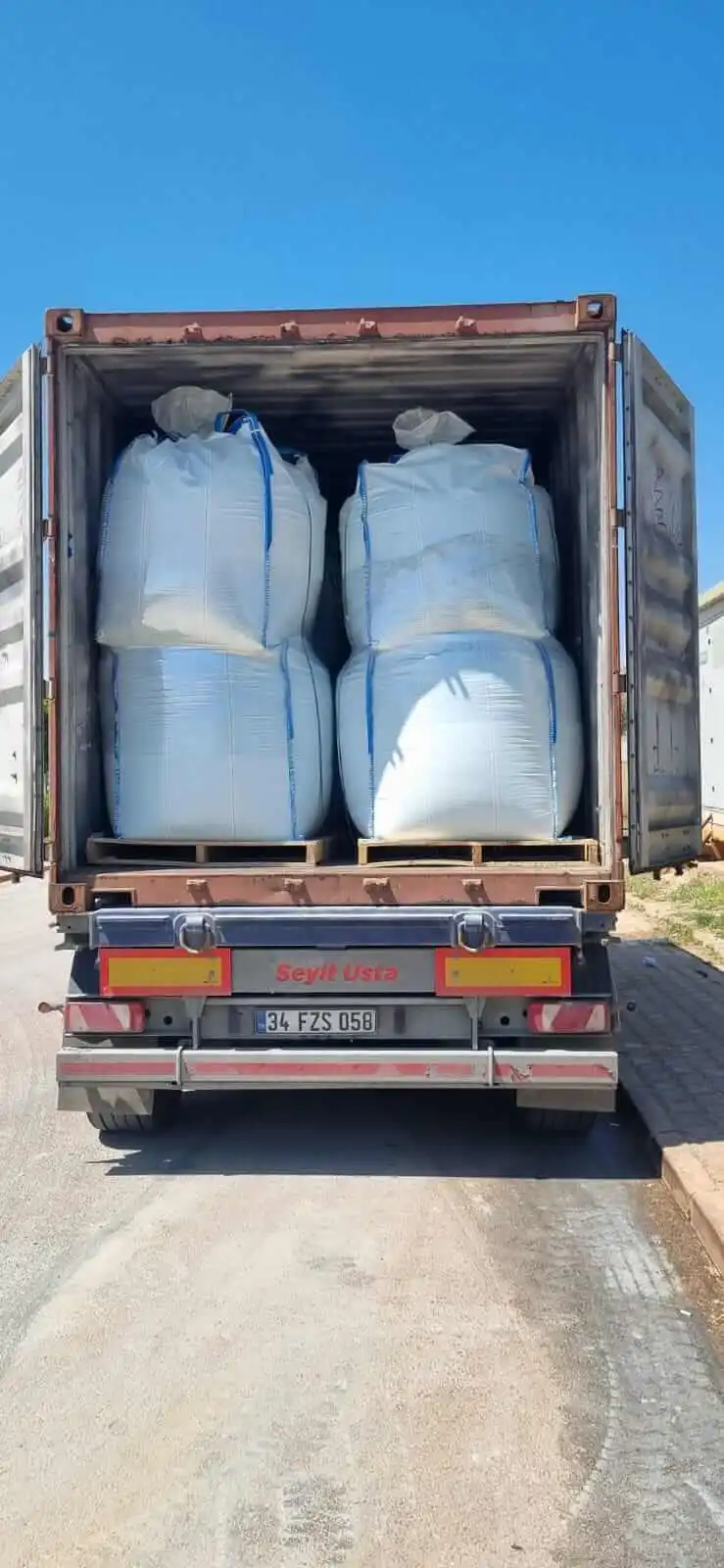 Ferrous sulfate heptahydrate big bags stacked two-high inside shipping container