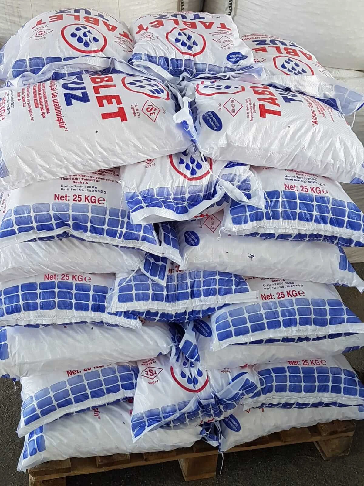 Water softener salt tablets in 25 kg bags stacked on pallet