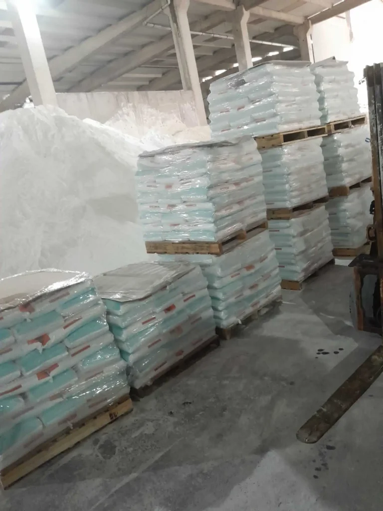 Sodium bisulfate 25 kg bags shrink-wrapped on pallets in warehouse