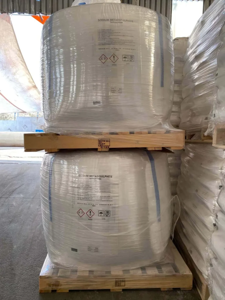 Stacked big bags of sodium metabisulfite on pallets for bulk supply